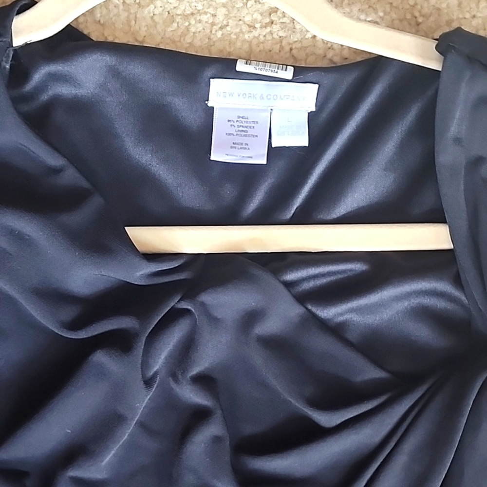 I'm selling a sexy Black mid length dress from New York & Company  in size L.
